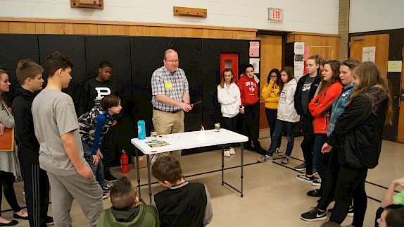 Mark Henning demonstrates the difference between ethanol and gasoline